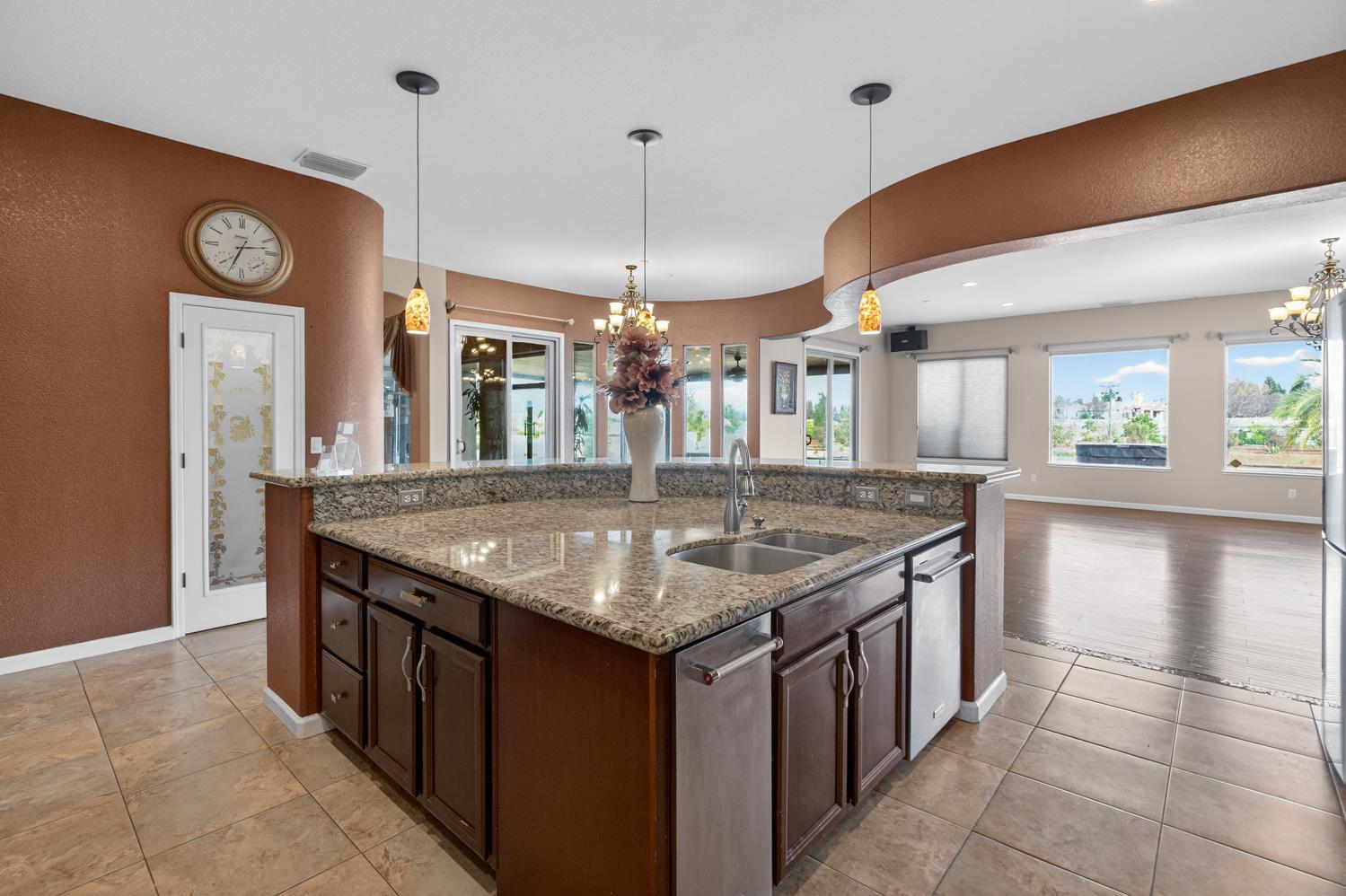 9601 Stablegate Road Wilton, CA 95693 - Photo 16 of 92 a kitchen with granite countertop cabinets a table and chairs in it