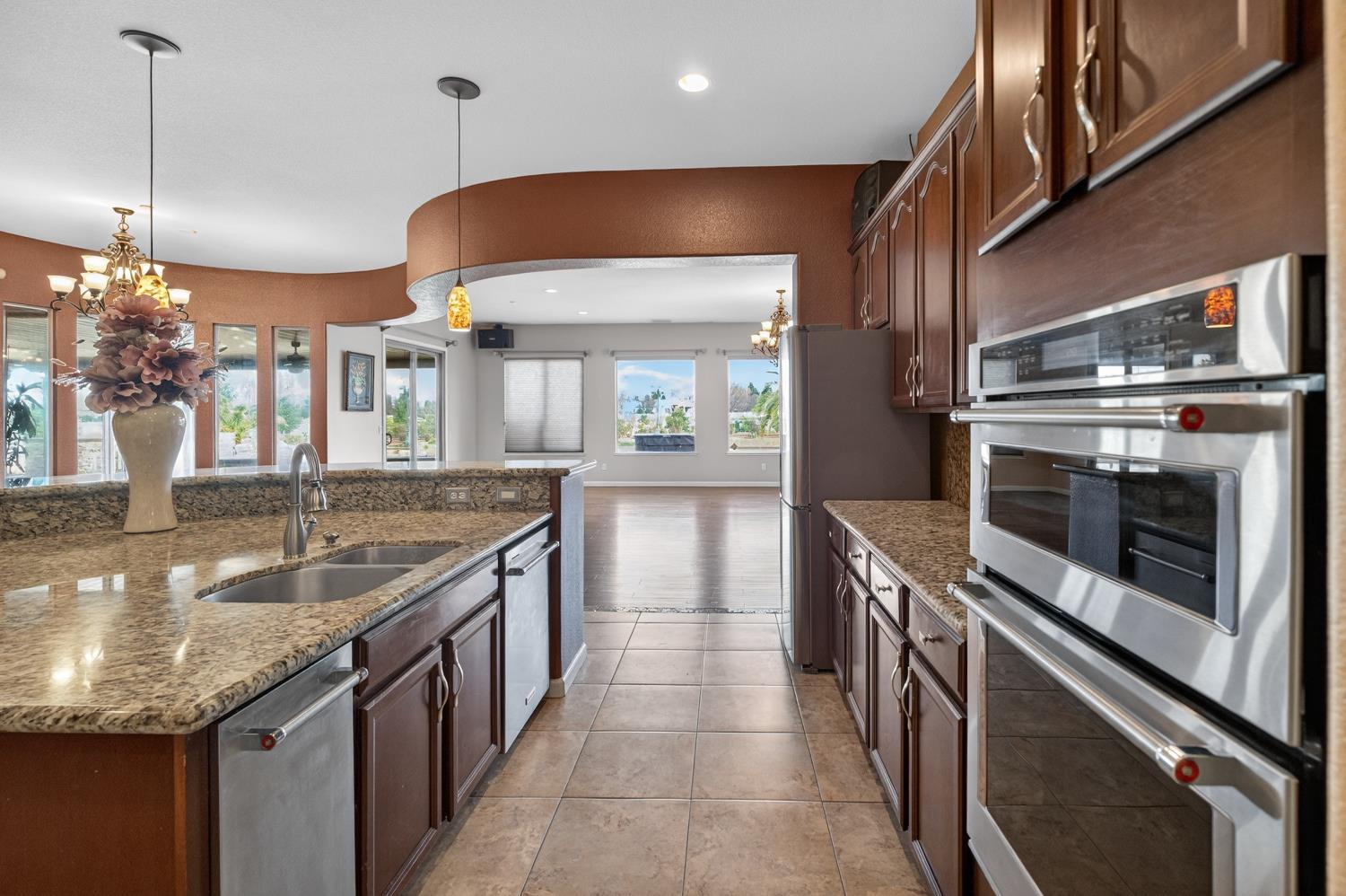 9601 Stablegate Road Wilton, CA 95693 - Photo 17 of 92 a kitchen with stainless steel appliances granite countertop a sink and a stove