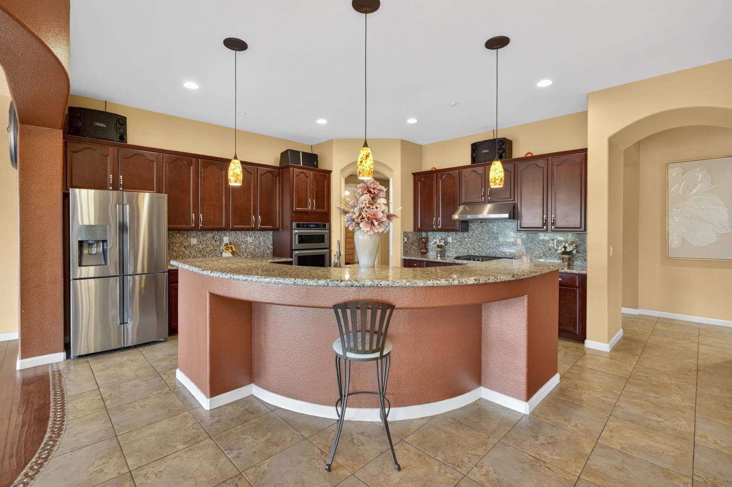 9601 Stablegate Road Wilton, CA 95693 - Photo 19 of 92 a kitchen with stainless steel appliances granite countertop a stove a sink a refrigerator and a oven
