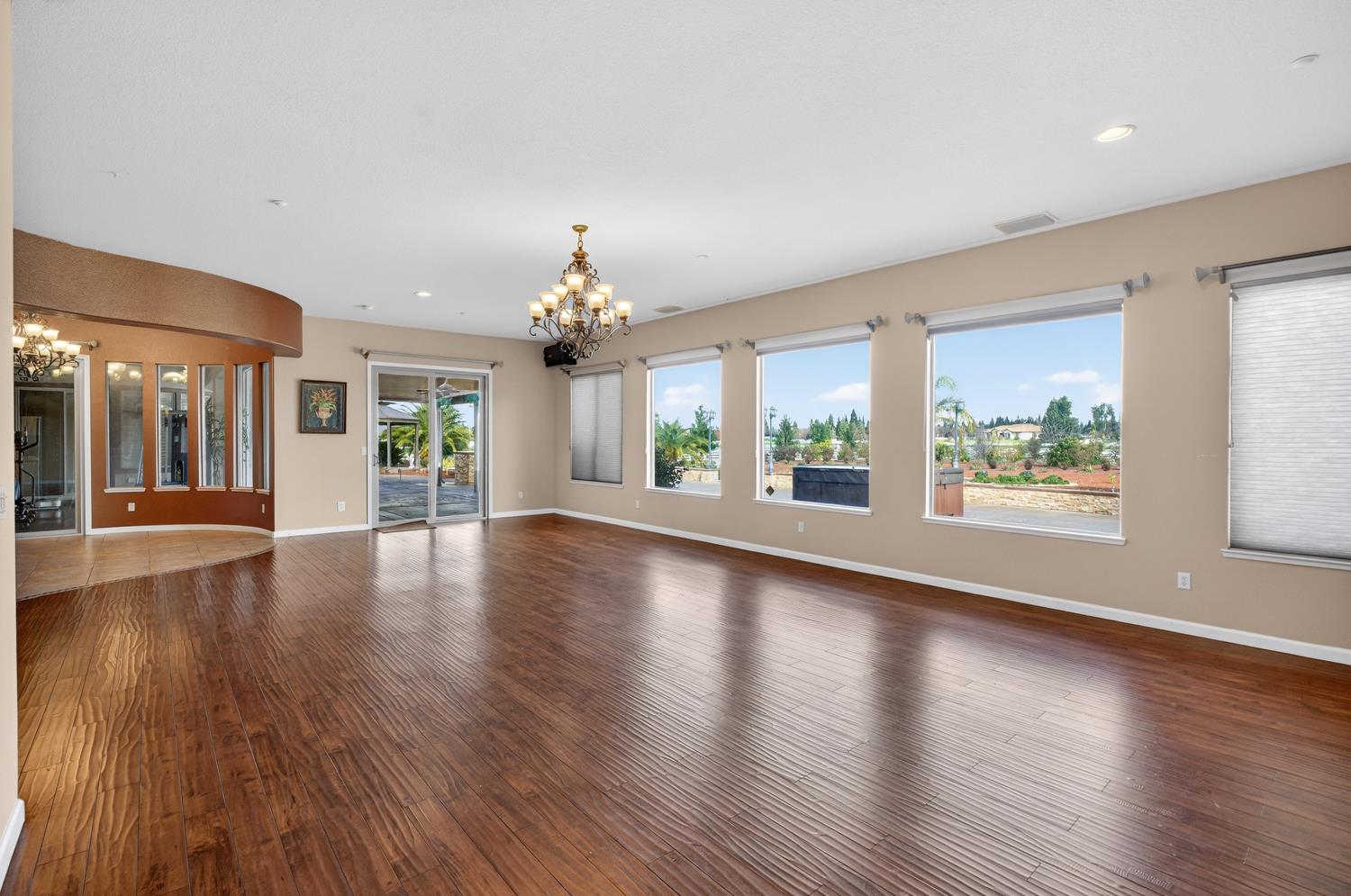 9601 Stablegate Road Wilton, CA 95693 - Photo 28 of 92 an empty room with wooden floor and windows