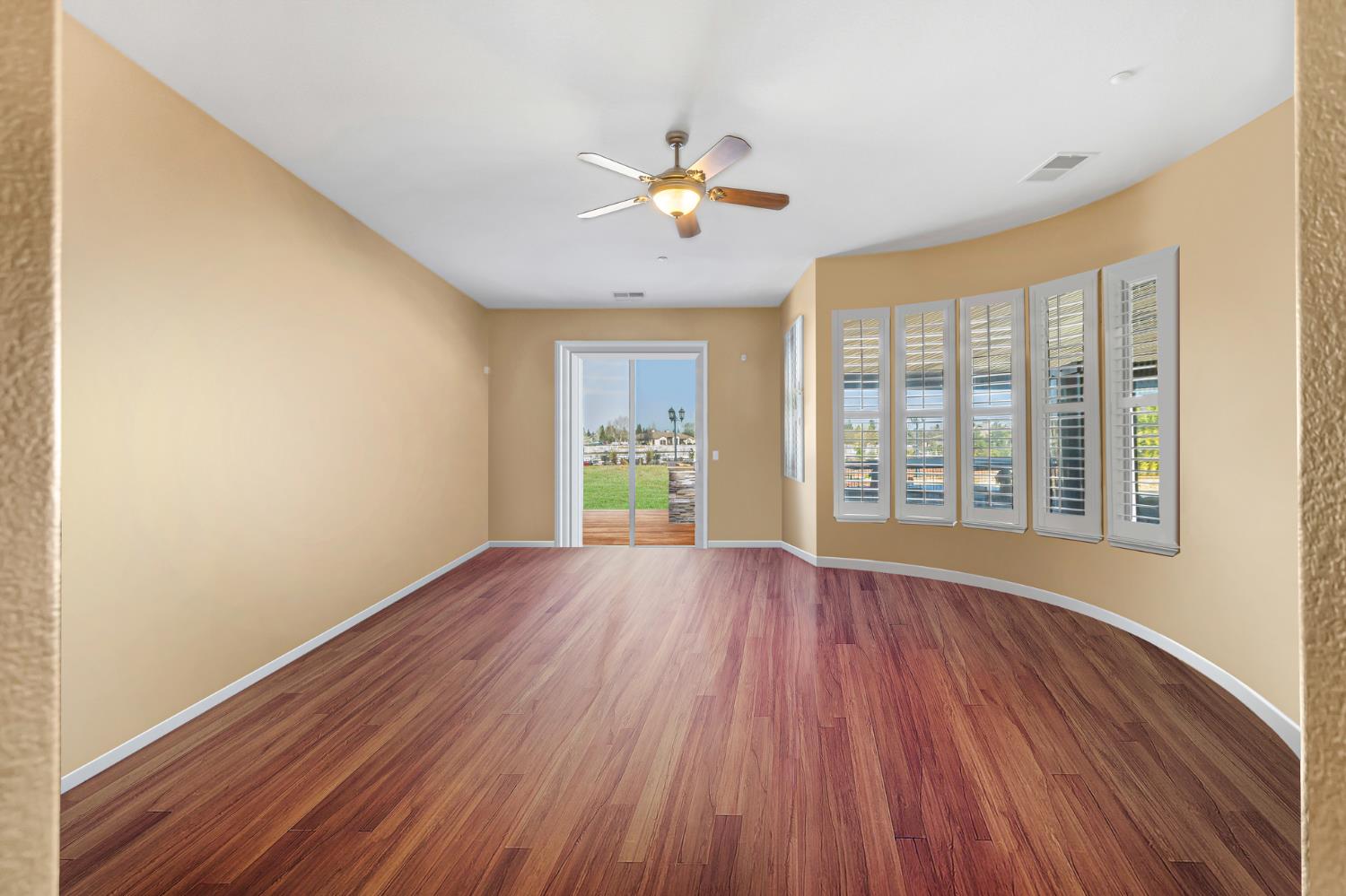 9601 Stablegate Road Wilton, CA 95693 - Photo 34 of 92 a view of an empty room with wooden floor and a window