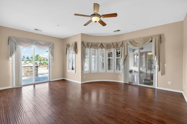 a bathroom with a granite countertop sink double vanity and a mirror