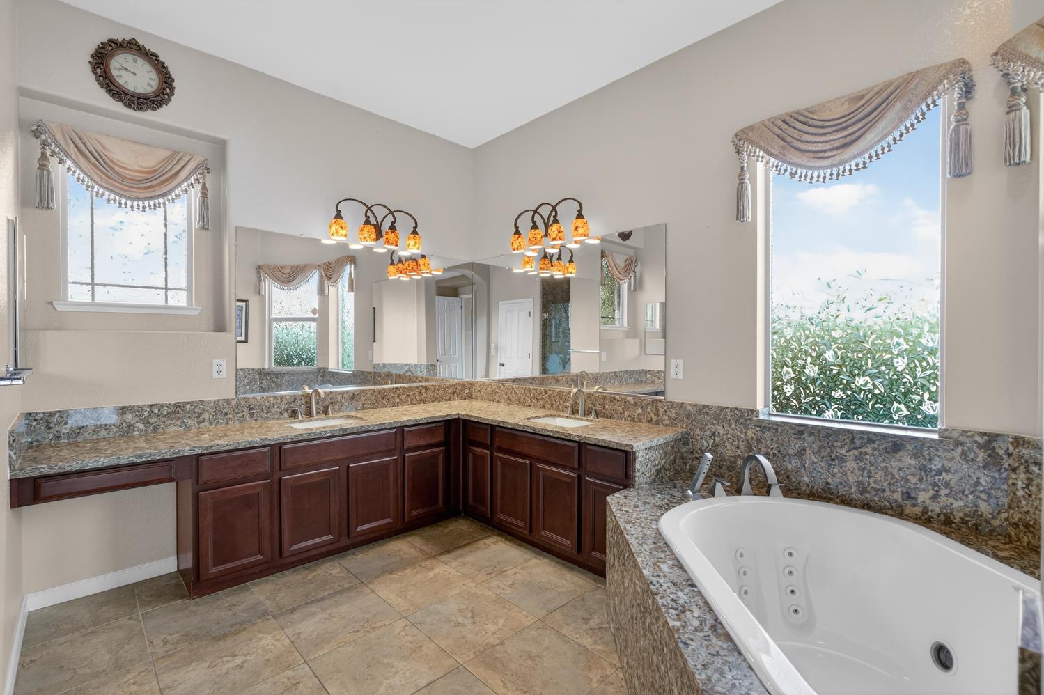 9601 Stablegate Road Wilton, CA 95693 - Photo 37 of 92 a bathroom with a granite countertop sink and a bathtub