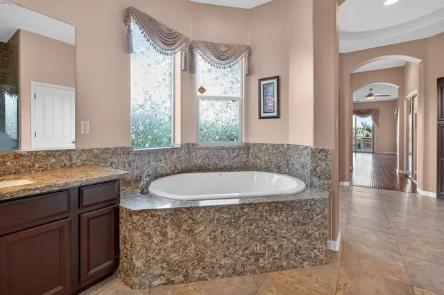 a bathroom with a bathtub and a shower