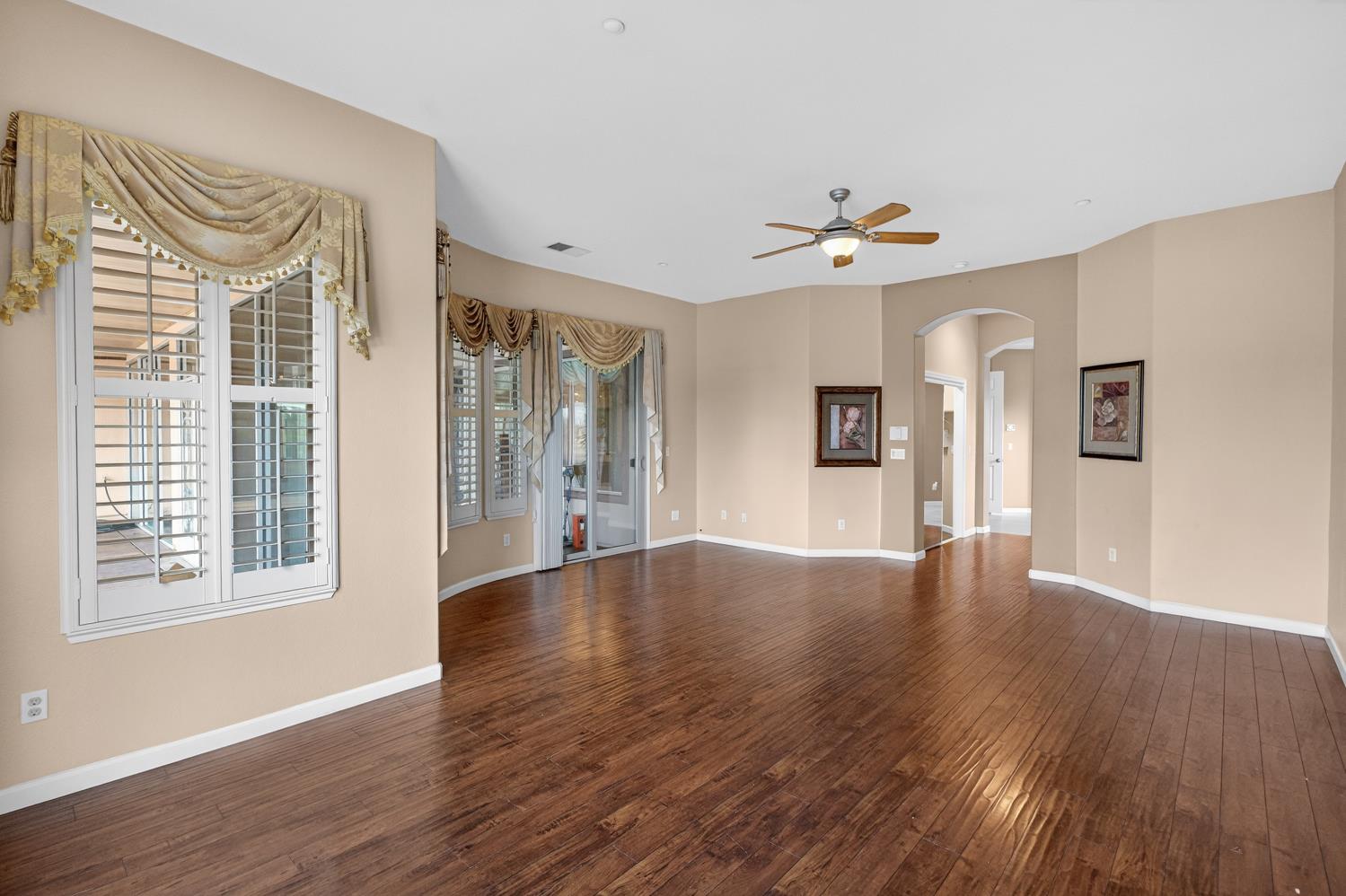 9601 Stablegate Road Wilton, CA 95693 - Photo 42 of 92 a view of an empty room with window and wooden floor