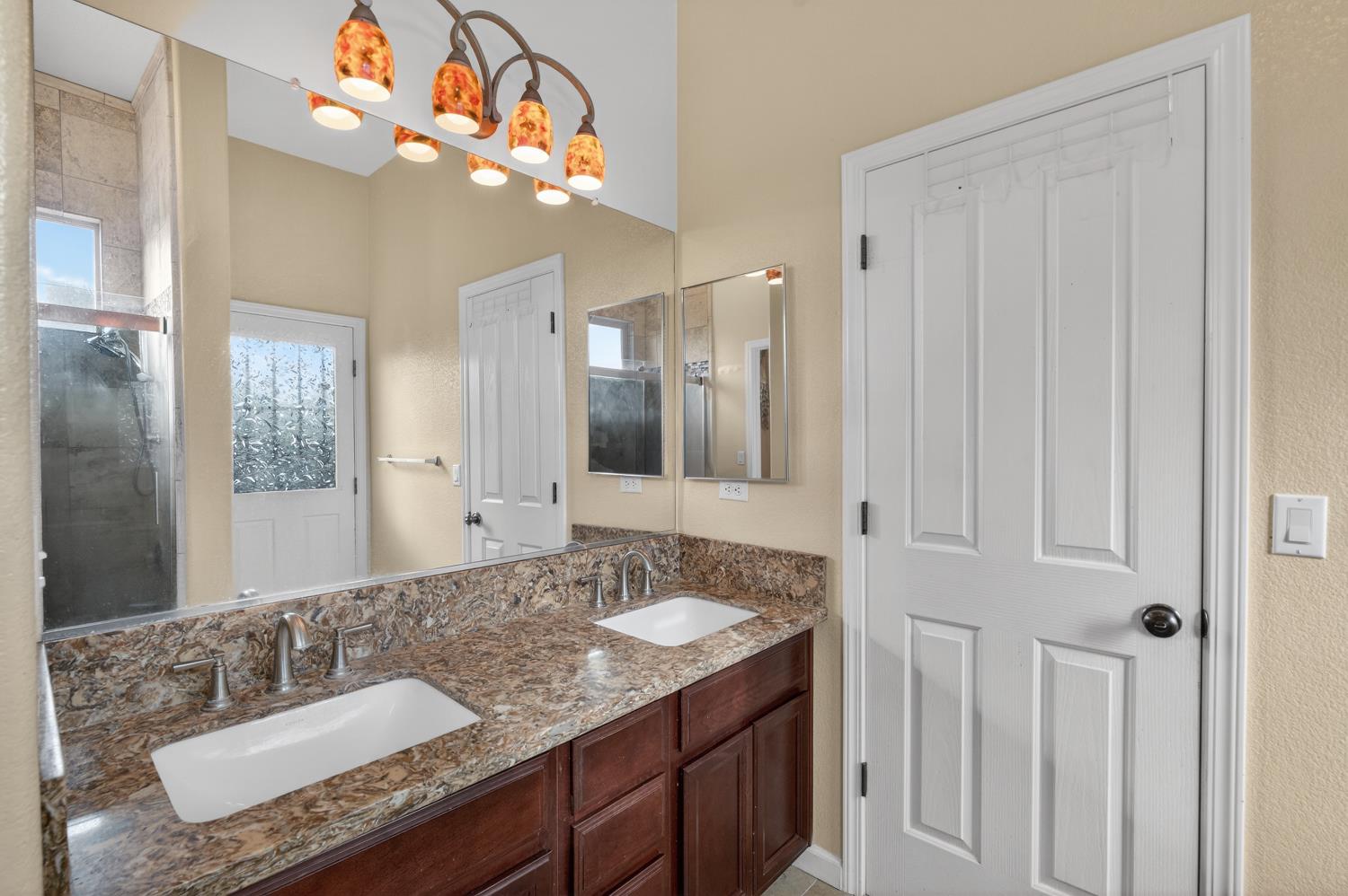 9601 Stablegate Road Wilton, CA 95693 - Photo 58 of 92 a bathroom with a sink vanity and a mirror