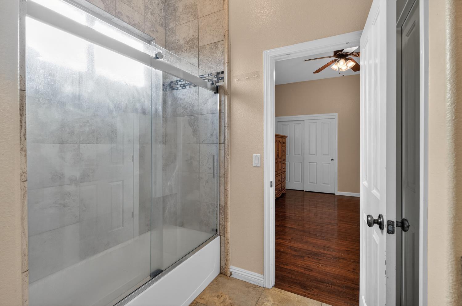 9601 Stablegate Road Wilton, CA 95693 - Photo 60 of 92 a bathroom with a bathtub and a shower