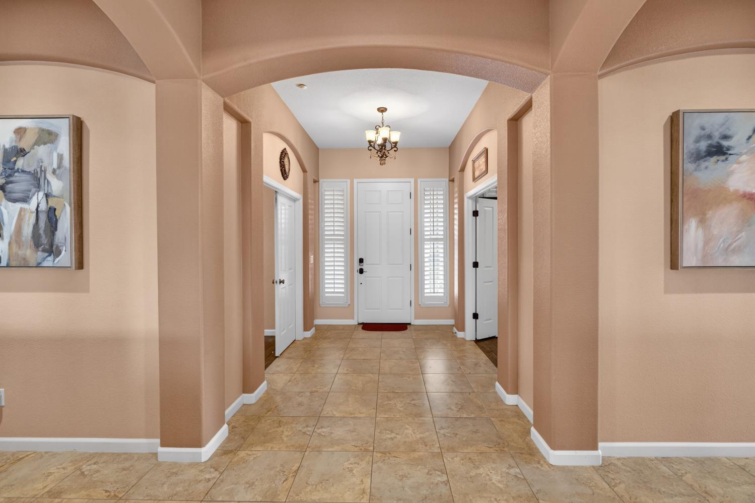 9601 Stablegate Road Wilton, CA 95693 - Photo 6 of 92 a view of a hallway with wooden floor and closet