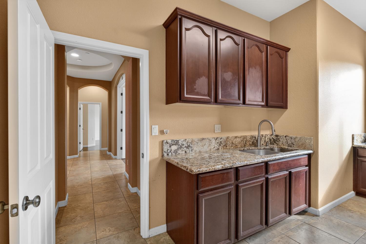 9601 Stablegate Road Wilton, CA 95693 - Photo 66 of 92 a bathroom with a granite countertop sink and a mirror