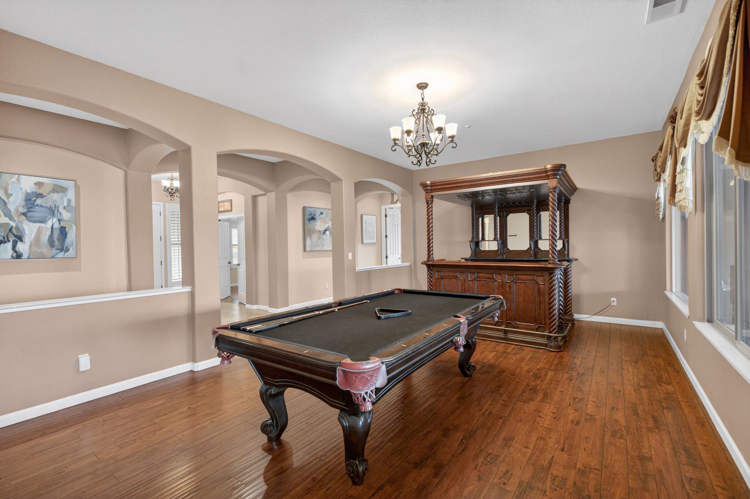 9601 Stablegate Road Wilton, CA 95693 - Photo 7 of 92 a living room with a table wooden floor and a window