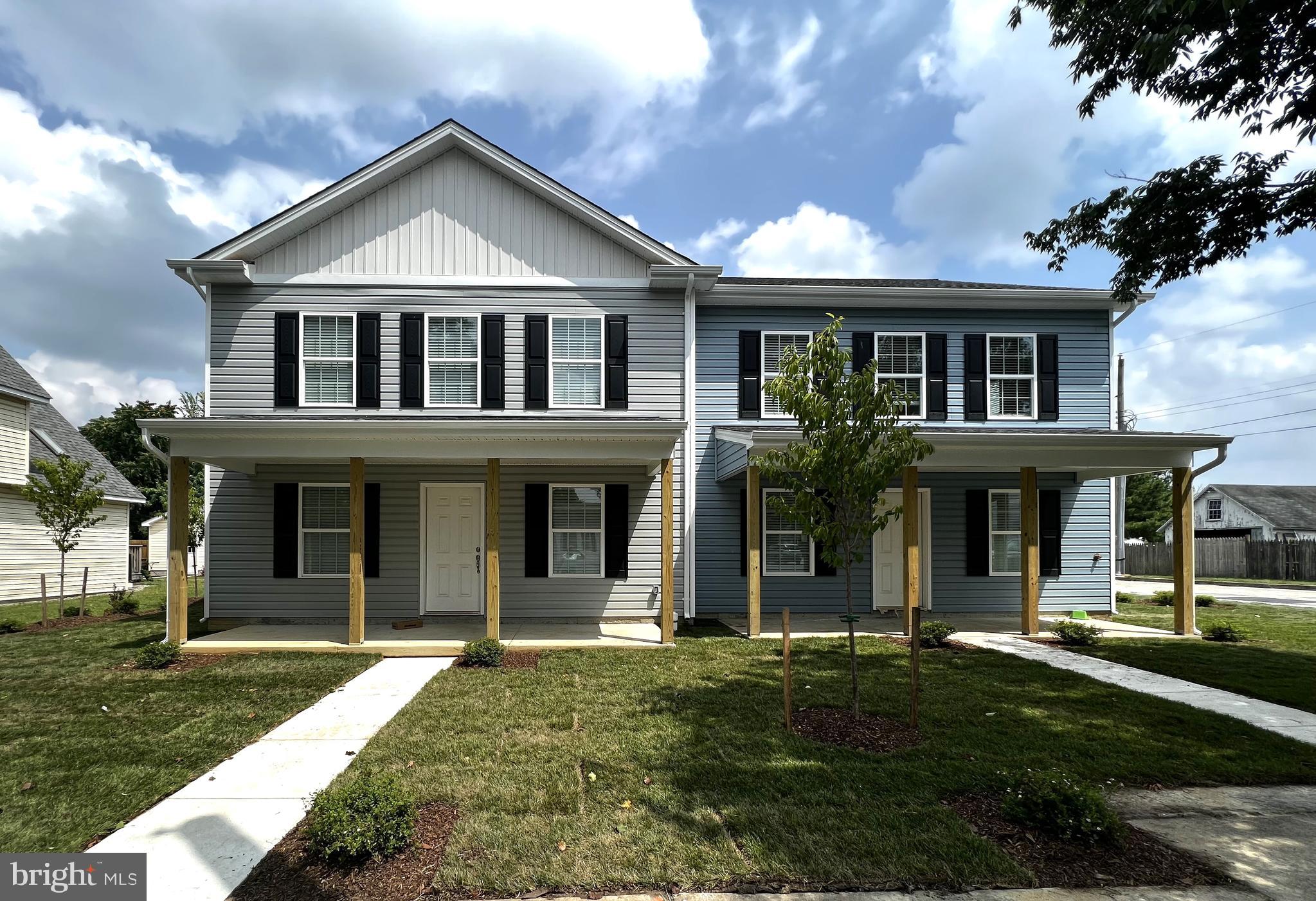 100 North 6th Street, Unit 100 Denton, MD 21629 - Photo 1 of 10 front view of a house with a yard