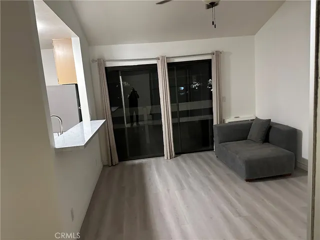 a living room with furniture and a walk in closet