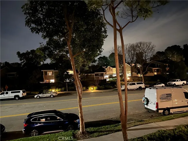a view of a street with cars
