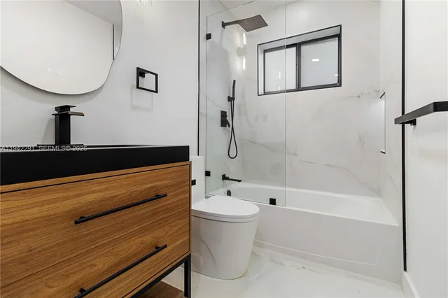 a bathroom with a bathtub and a toilet