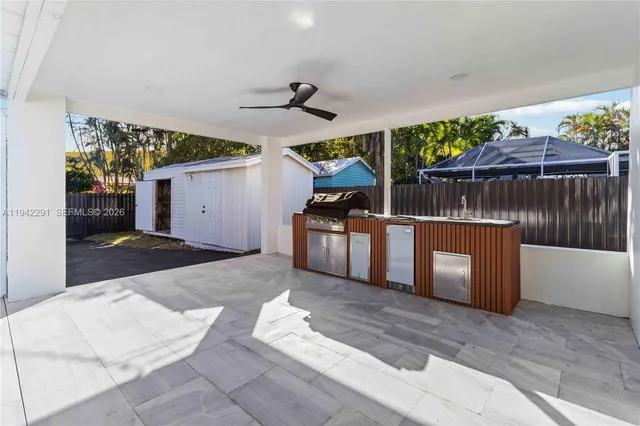 a view of a room with wooden cabinets