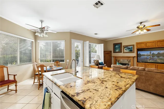 a living room with fireplace and flat screen tv