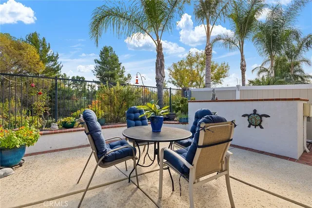 a view of a swimming pool and lounge chair