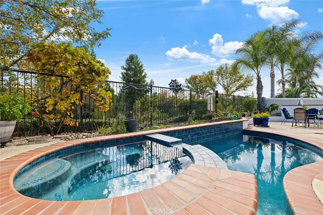 a view of house with garden and patio