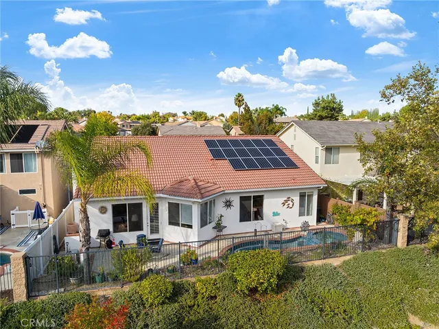 an aerial view of multiple houses with yard