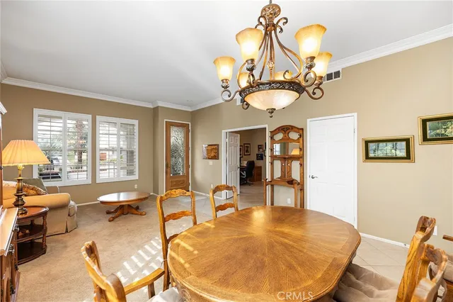 a view of a livingroom with dining room and furniture