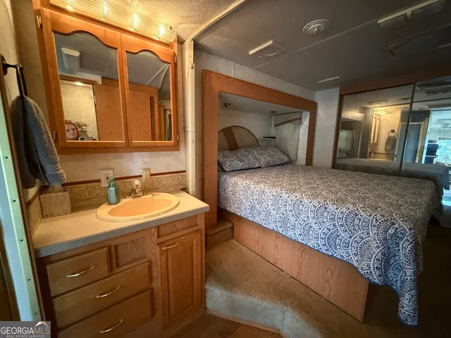 a bathroom with a sink and a mirror