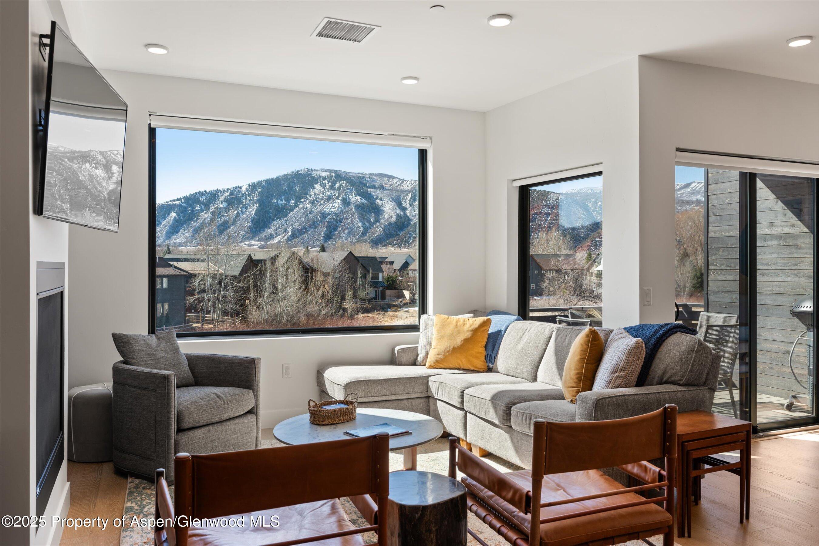 220 Lewis Lane Basalt, CO 81621 - Photo 4 of 32 a living room with furniture and a large window