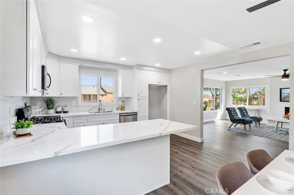 445 Via Val Verde Montebello, CA 90640 - Photo 14 of 51 a large white kitchen with lots of counter space