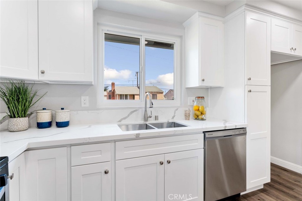 445 Via Val Verde Montebello, CA 90640 - Photo 17 of 51 a kitchen with white cabinets and a sink