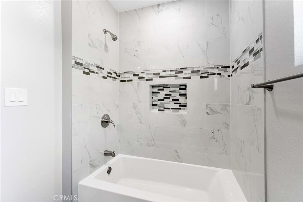 445 Via Val Verde Montebello, CA 90640 - Photo 22 of 51 a bathroom with a bathtub and shower