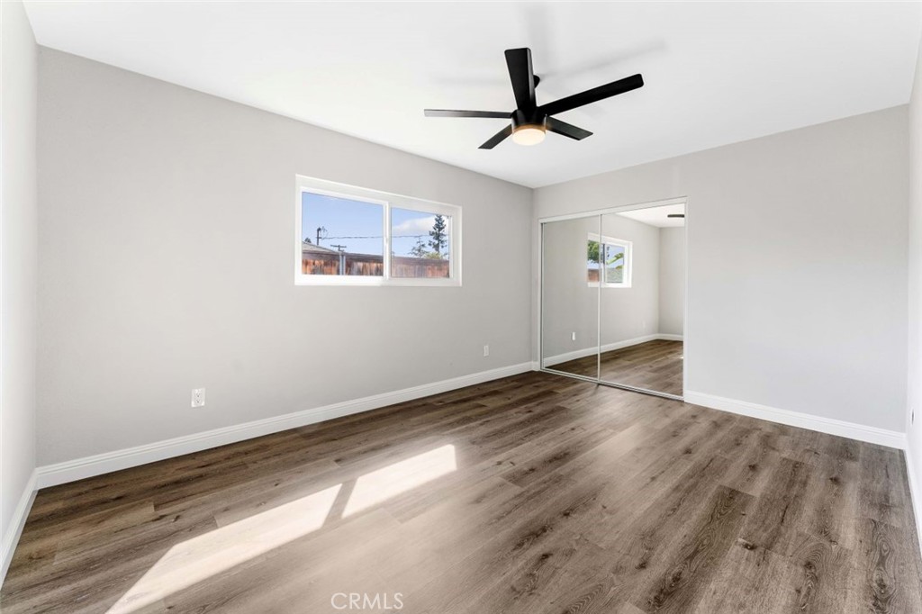 445 Via Val Verde Montebello, CA 90640 - Photo 24 of 51 a view of a big room with wooden floor a ceiling fan