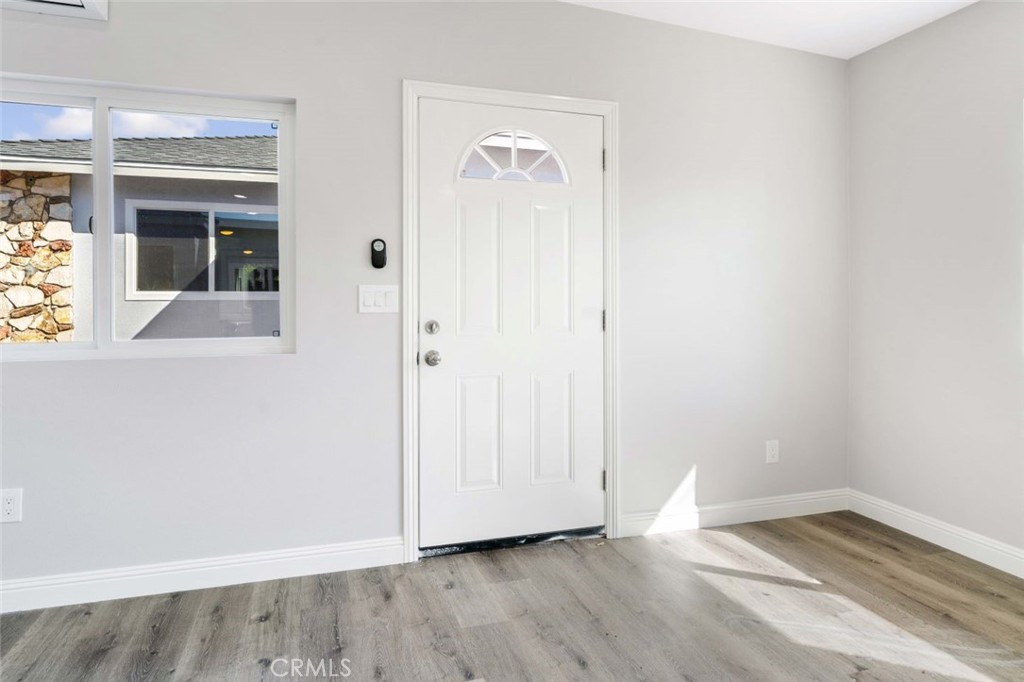 445 Via Val Verde Montebello, CA 90640 - Photo 28 of 51 an empty room with wooden floor and windows