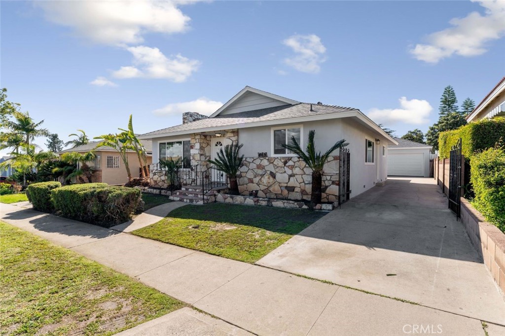 445 Via Val Verde Montebello, CA 90640 - Photo 3 of 51 a front view of a house with garden