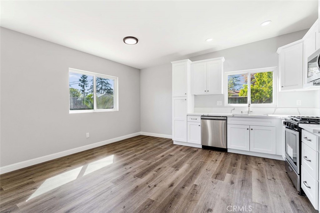 445 Via Val Verde Montebello, CA 90640 - Photo 32 of 51 a view of a kitchen with wooden floor and electronic appliances