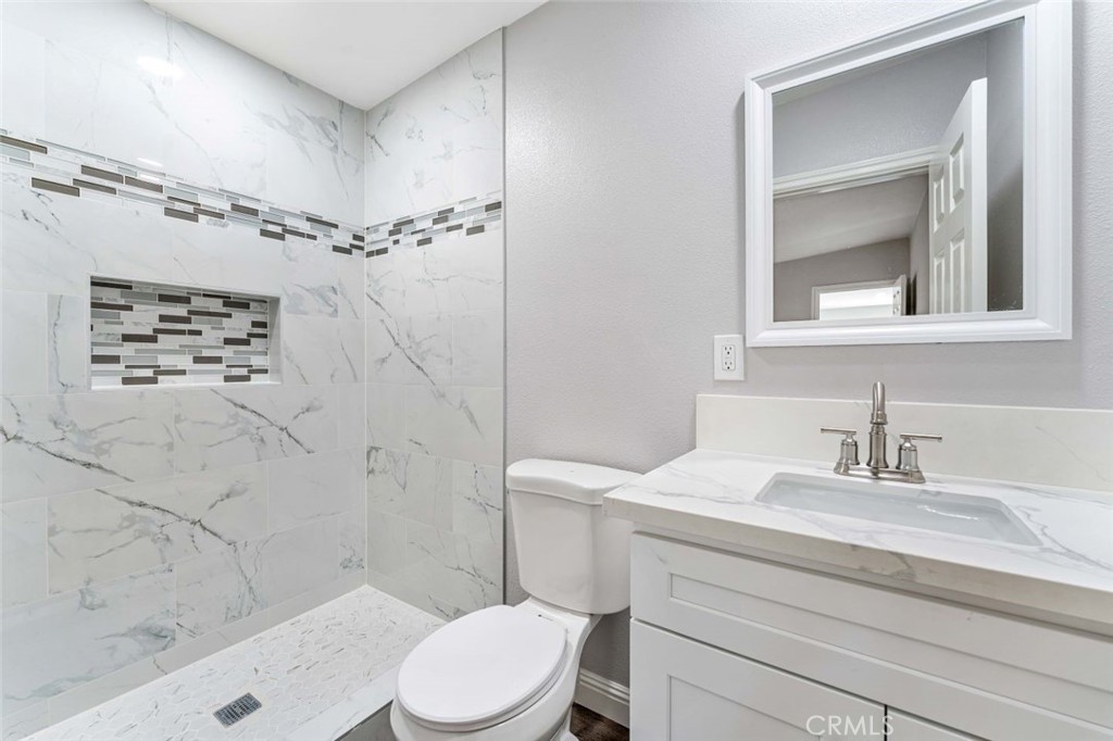 445 Via Val Verde Montebello, CA 90640 - Photo 38 of 51 a bathroom with a sink a toilet and shower