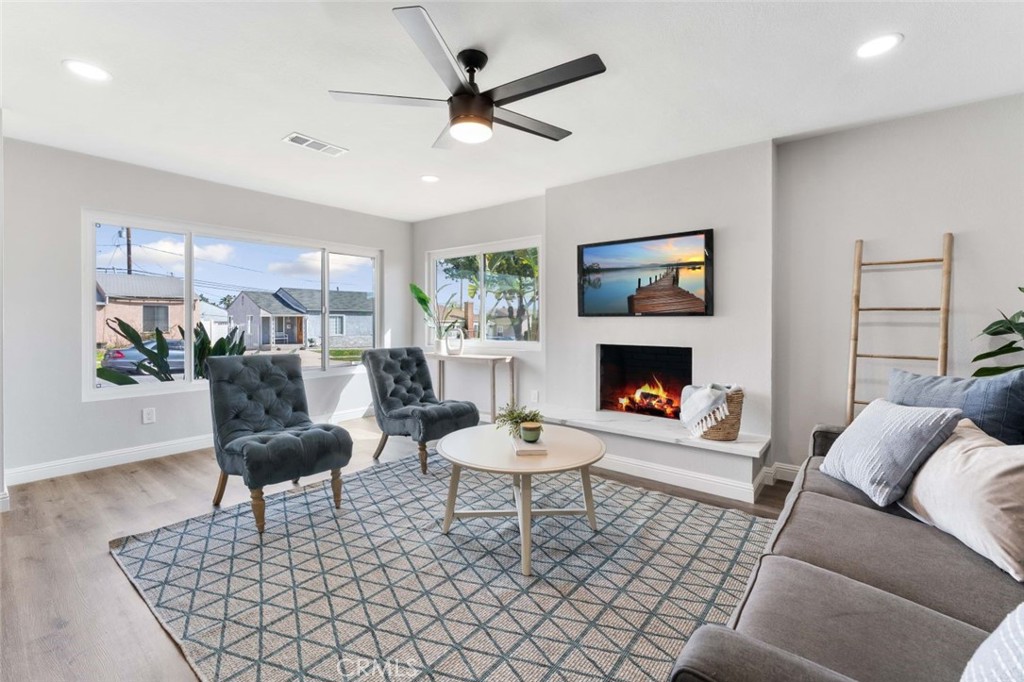445 Via Val Verde Montebello, CA 90640 - Photo 6 of 51 a living room with furniture a window and a fireplace