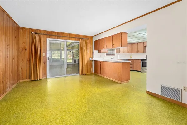 a view of kitchen and wooden floor