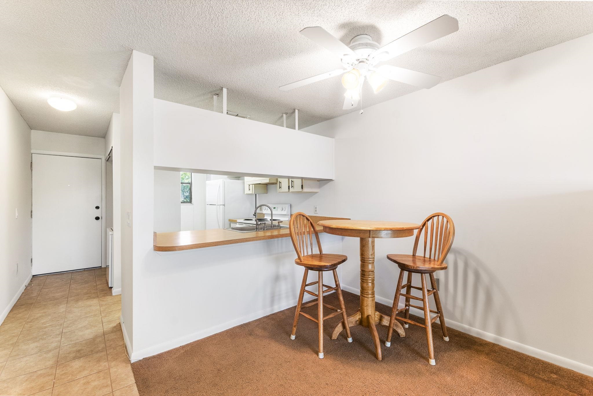 700 West Pope Road, Unit D28 St. Augustine, FL 32080 - Photo 13 of 32 Dining area featuring sink, a textured ceiling, ceiling fan, and light tile flooring