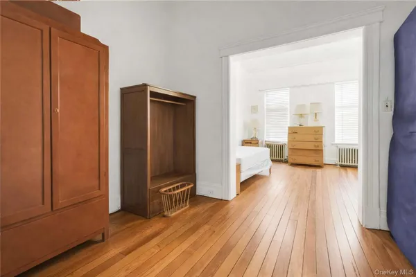 a room with pool table windows and wooden floor