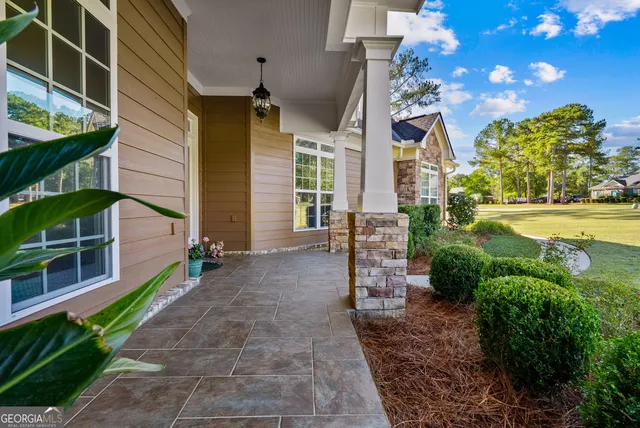 a dining room with furniture and chandelier