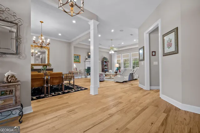 a living room with fireplace furniture and a flat screen tv