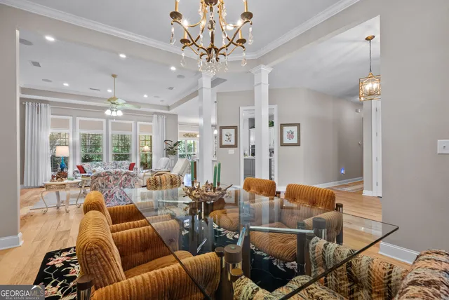a kitchen with a sink stove cabinets and refrigerator