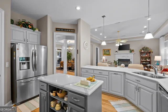 a view of a dining room with furniture wooden floor and chandelier