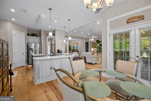 a bedroom with bed and a chandelier