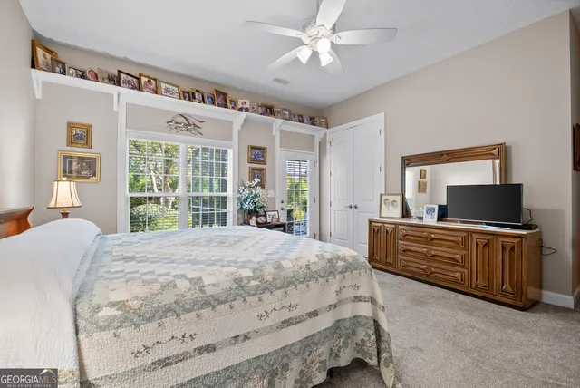 a bedroom with a bed and furniture