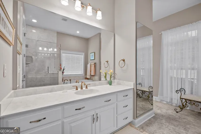 a bedroom with a bed and ceiling fan