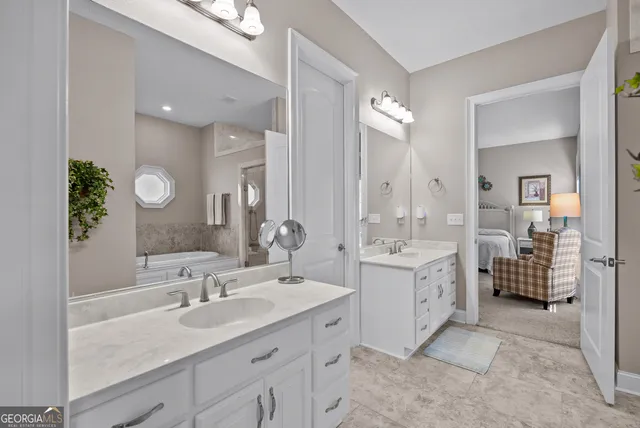 a living room with furniture a desk and chair