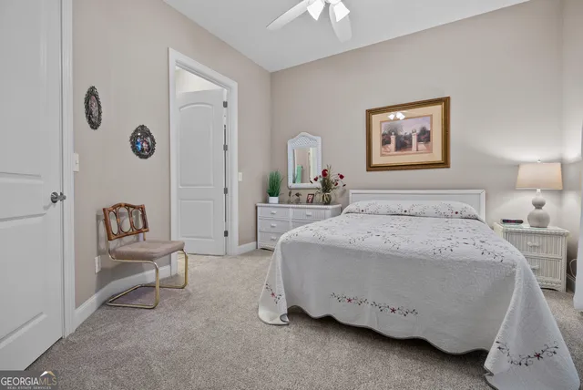 a view of a yard with wooden fence