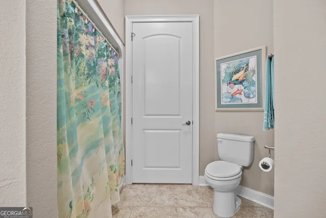 a front view of a house with a yard table and chairs