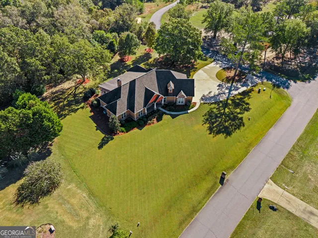a front view of house with yard and swimming pool