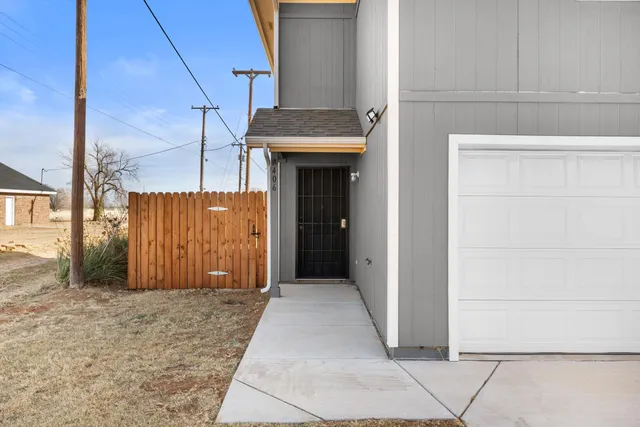 a view of a front door and wooden floor